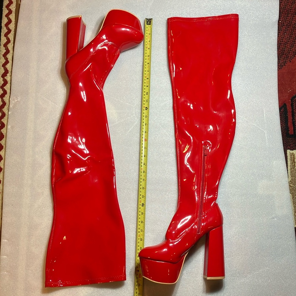 Red patent thigh high platform boots. Unworn.